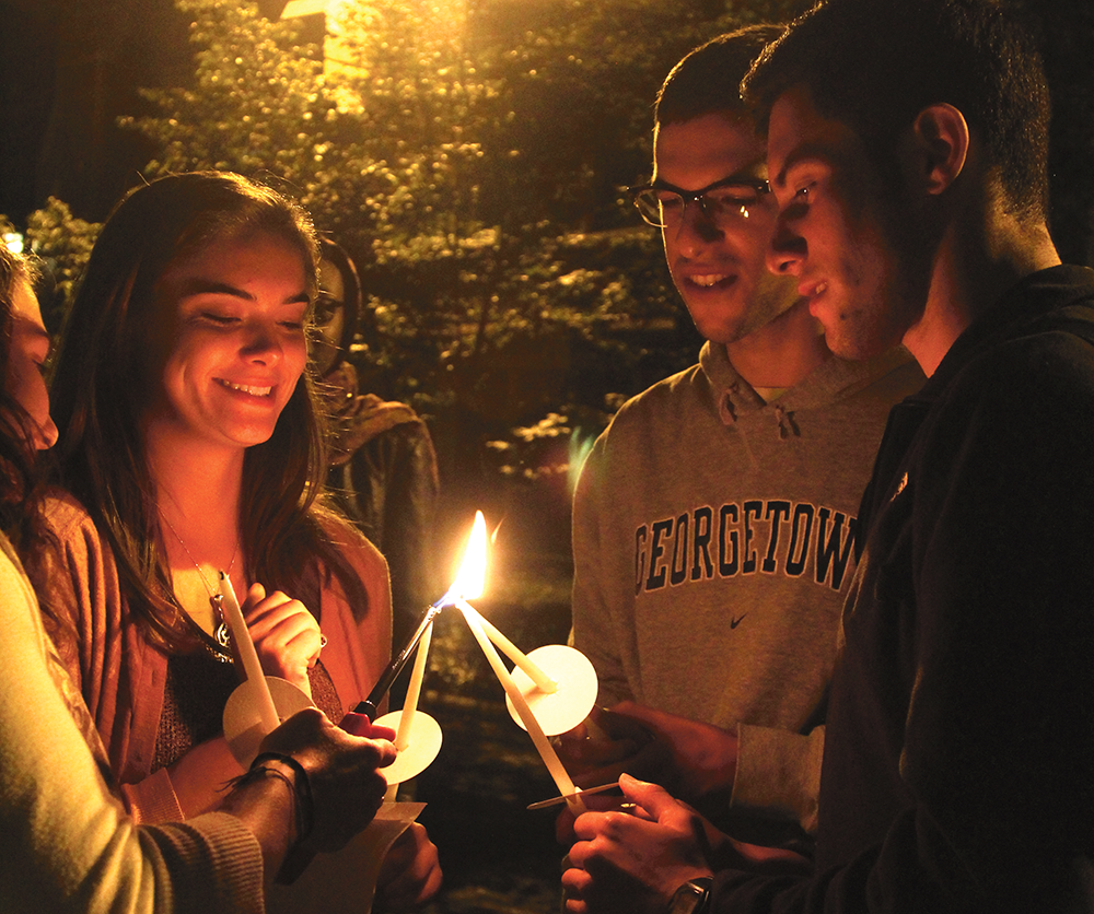 ARIANA TAFTI FOR THE HOYA
Students lit candles in memory of the victims of the Israel-Palestine conflict at a vigil on Thursday night.