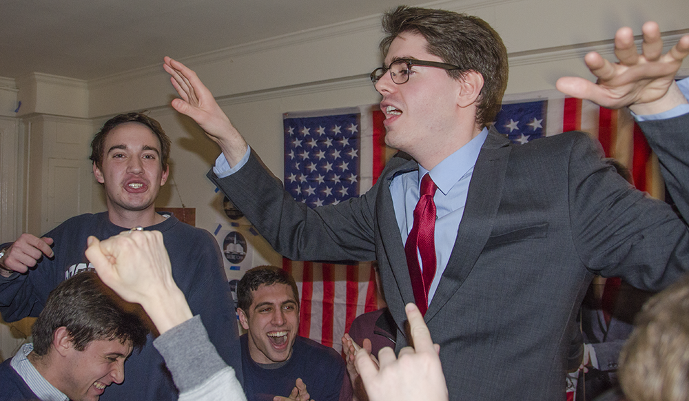 KATHLEEN GUAN FOR THE HOYA
Joe Luther (COL ’16), left, and Connor Rohan (COL ’16) celebrate after the success of their satirical YouTopia campaign. The pair attempted to engage fatigued voters by criticizing the association for being out of touch.