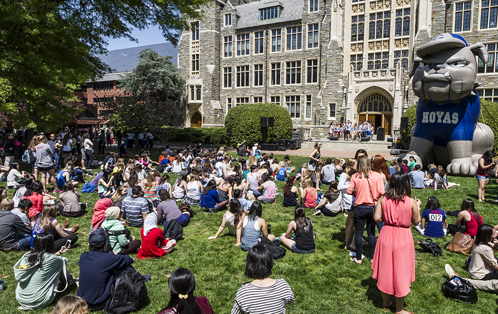FILE PHOTO ALEXANDER BROWN
Students listen to a capella performances on Copley Lawn during Georgetown Day, the annual campus-wide celebration of the end of spring semester. 