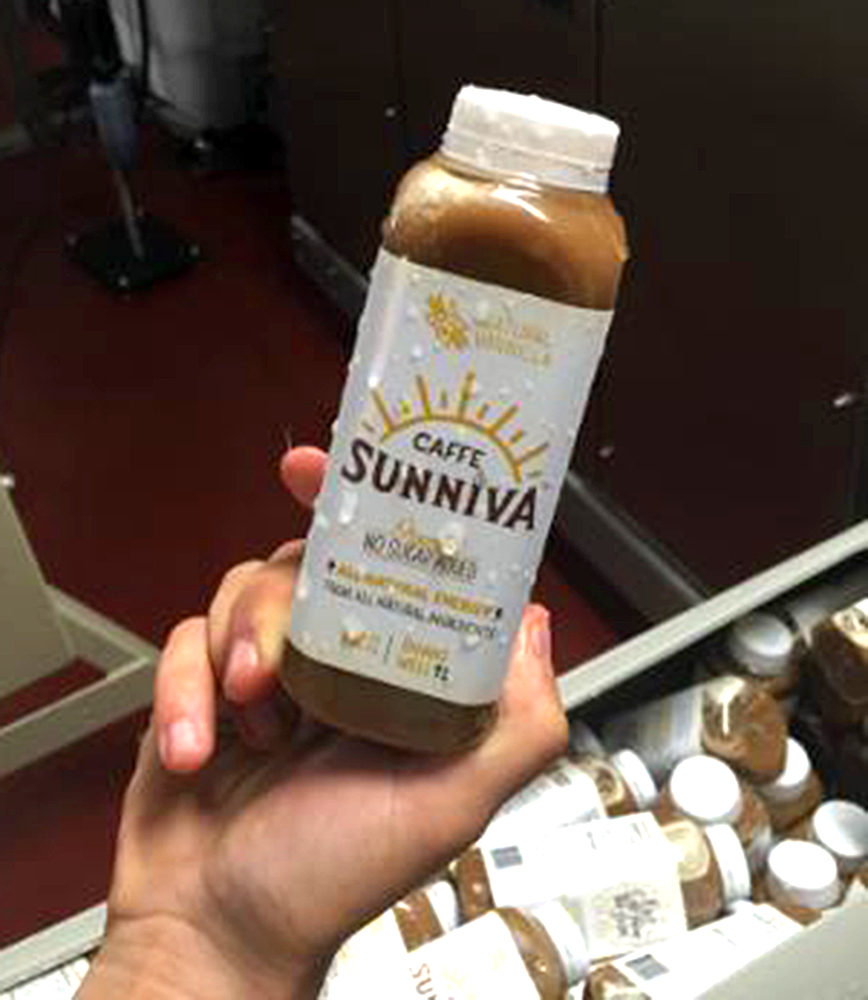 COURTESY JAKE DECICCO
Jake DeCicco inspects a bottle of Sunniva Caffe at the company’s production facility in Elkridge, Md. On Monday the product will officially launch in 11 regional Whole Foods stores.
