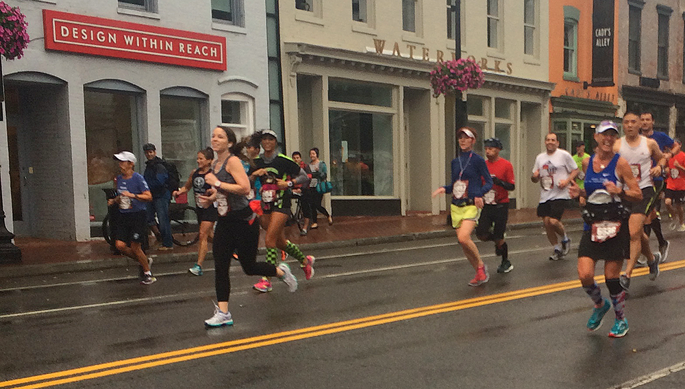 courtney klein/the hoya
Runners stream down M Street in Georgetown as part of the Marine Corps Marathon, which saw 30,000 racers, many from the university, traverse the District.