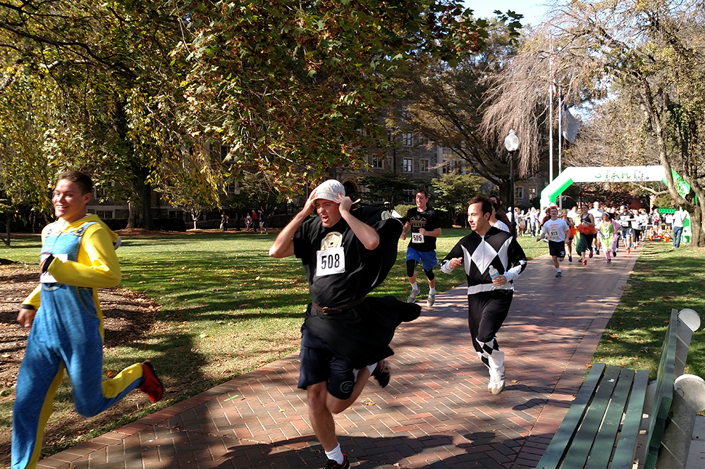 ASHWIN PURI/THE HOYA
Runners in costume took part in Sigma Phi Epsilon’s annual 5K Against Domestic Violence fundraiser benefitting Virginia nonprofit Doorways for Women and Families on Friday. Campus organizations such as Take Back the Night and Club Swimming were also official event supporters. 