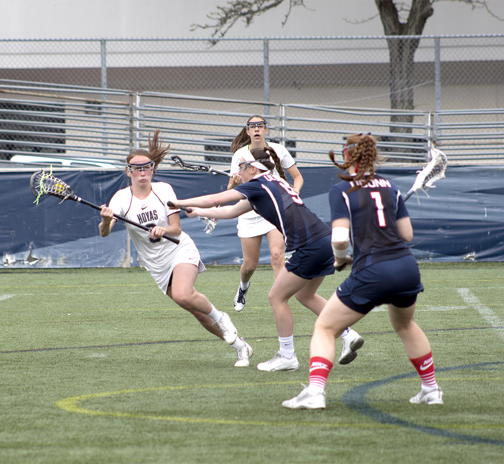 FILE PHOTO: CLAIRE SOISSON/THE HOYA
Junior attack Colleen Lovett, left, had one assist to senior attack Corinne Etchison in Georgetown’s 13-12 win over Marquette. Lovett has eight goals and five assists this season.