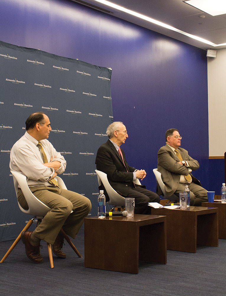 ANNA KOVACEVICH/ THE HOYA
Cybersecurity experts James Carafano ,left, Robert Lieber and Samuel Visner discussed the role of social media in Russian election interference. 