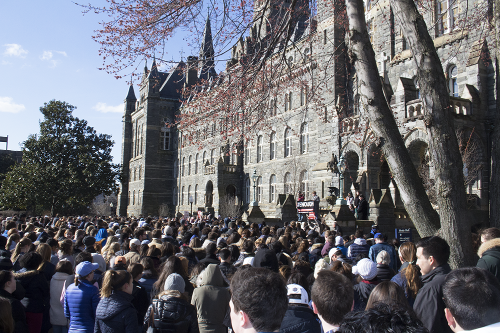 HANNAH LEVINE FOR THE HOYA Hundreds of Georgetown University students, faculty and community members gathered in front of Healey Hall at 10 a.m. Wednesday morning, calling for gun violence prevention in the aftermath of last month’s shooting in Parkland, Fla.