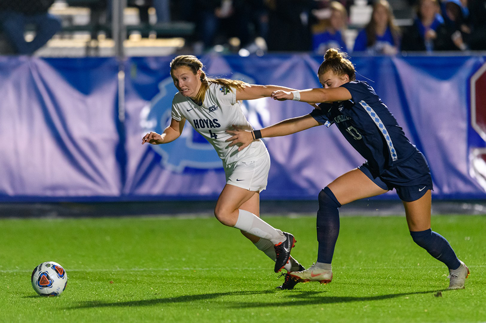 THE HOYA/Amber Kathryn Gillette| Graduate student forward Kyra Carusa outruns a UNC defender as she dribbles forward.