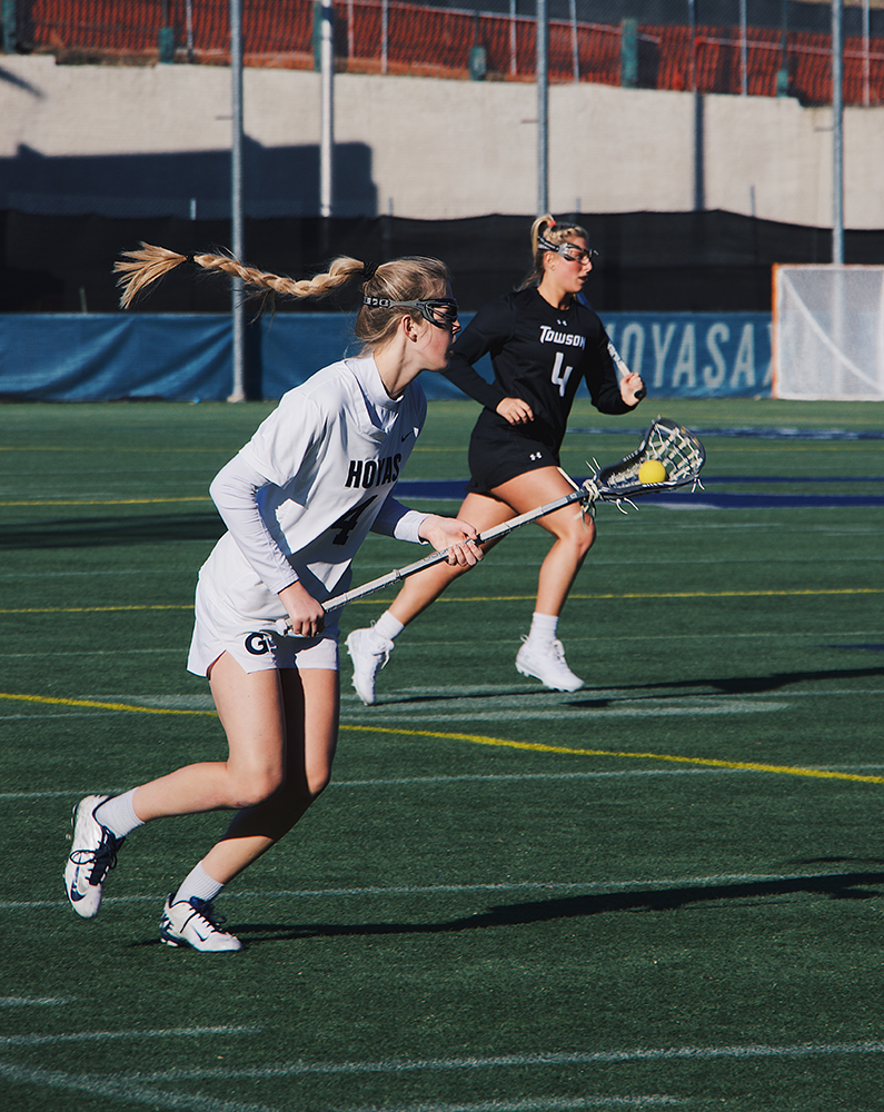 JULIA GIGANTE/FOR THE HOYA| Cradling the ball, junior attack Emily Ehle moves upfield against Towson. 