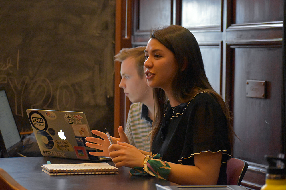 MARGARET FOUBERG/THE HOYA | The Georgetown University Student Association senate, headed by GUSA senate speaker Eliza Lafferty (COL â€™21), right, and vice speaker Patrick Walsh (SFS â€™21), left, reallocated an additional $1,222.39 to GUSA before approving the 2019-2020 fiscal year student activities budget March 24.
