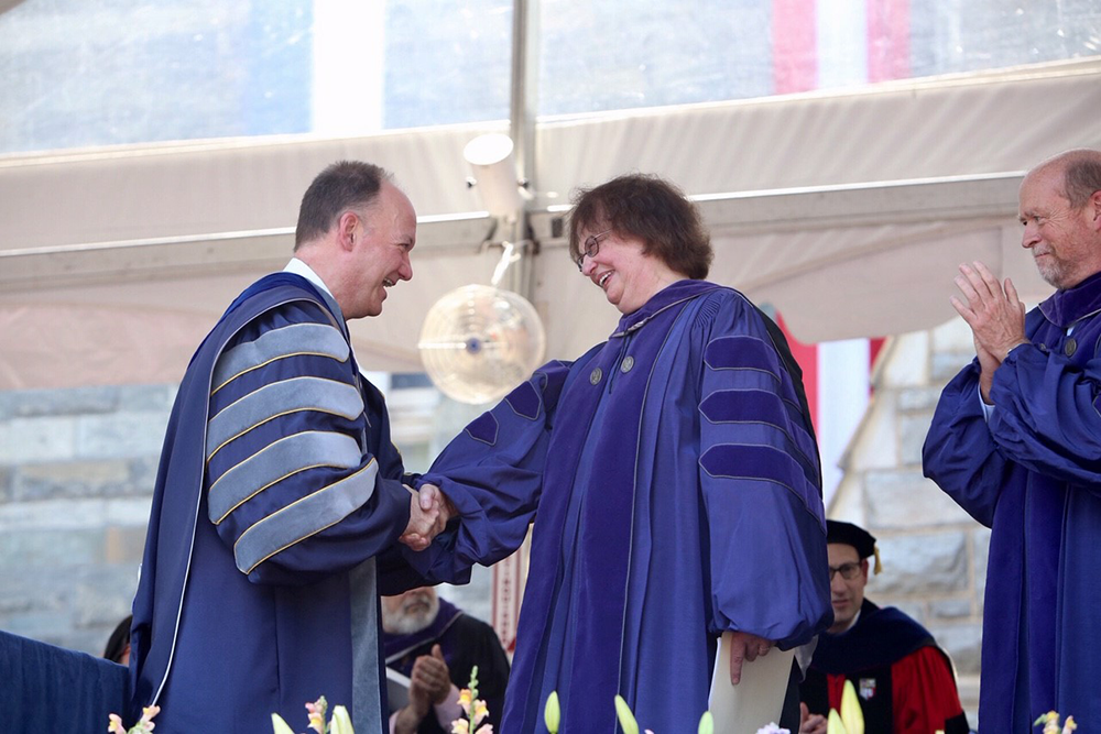 GEORGETOWN LAW CENTER FACEBOOK PAGE | New York Solicitor General Barbara Underwood (LAW 69), who addressed graduates at commencement, shakes hands with Georgetown University President John J. DeGioia.  