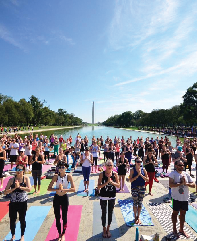 DC YOGA WEEK/FACEBOOK | Over 7,000 participants convene at the National Mall with their yoga mats to enjoy the summer morning. Yoga is a great practice to exercise both body and mind.
