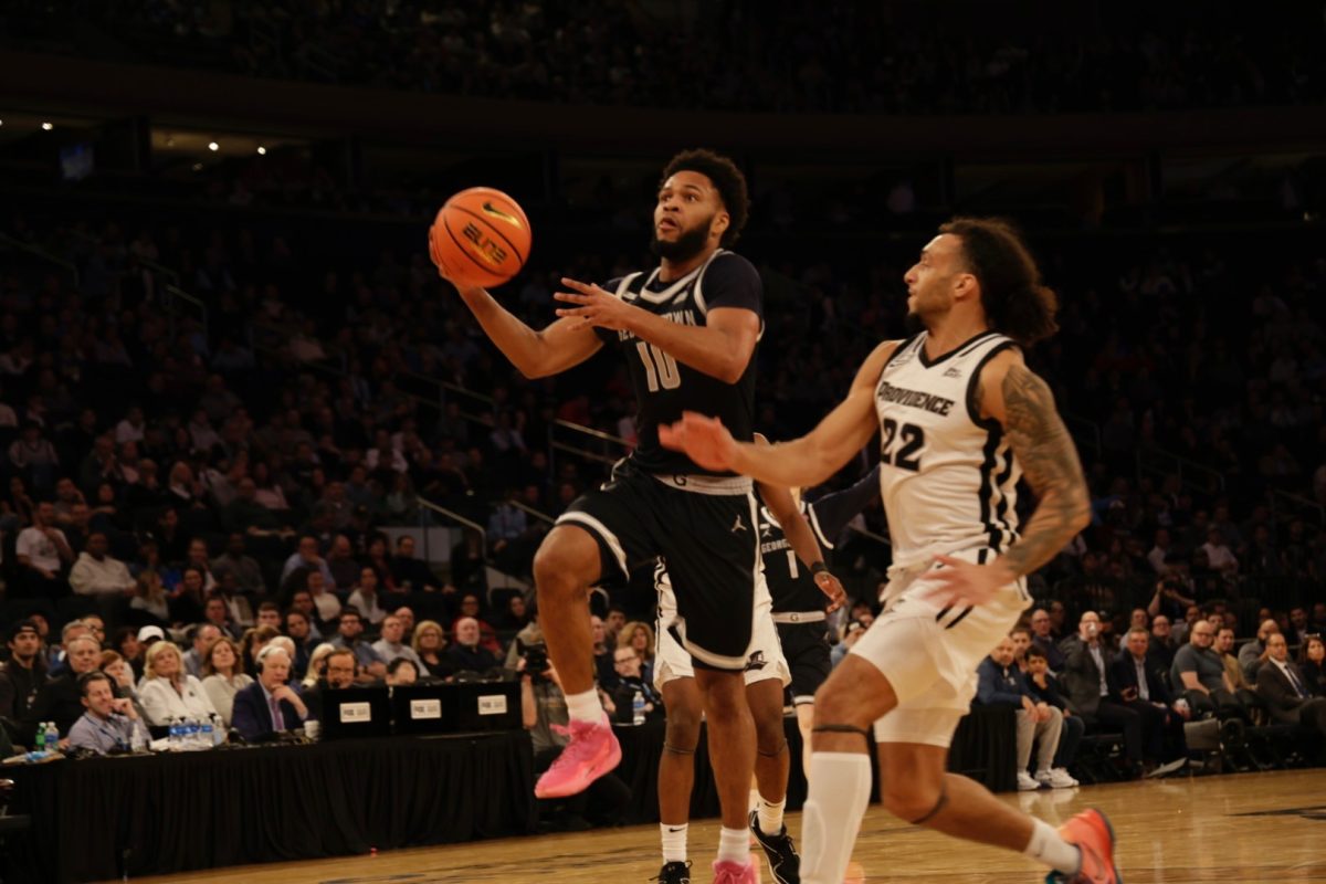 Photo by Haan Jun (Ryan) Lee | Sophomore guard Jayden Epps goes for a layup against Big East player of the year guard Devin Carter. Epps' 30-piece is the most by a Hoya in a Big East tournament game since Jeff Green (COL '12) in 2007.
