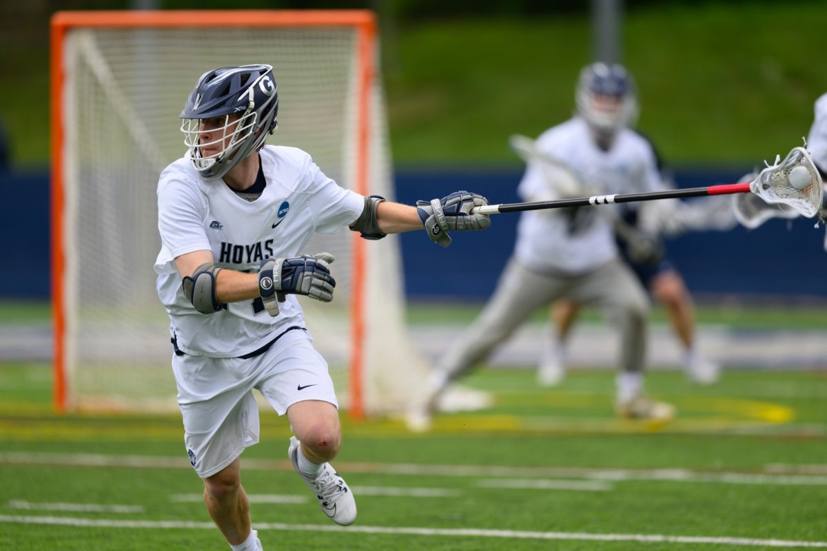 GU Hoyas l Hoya defender reaches for the ball