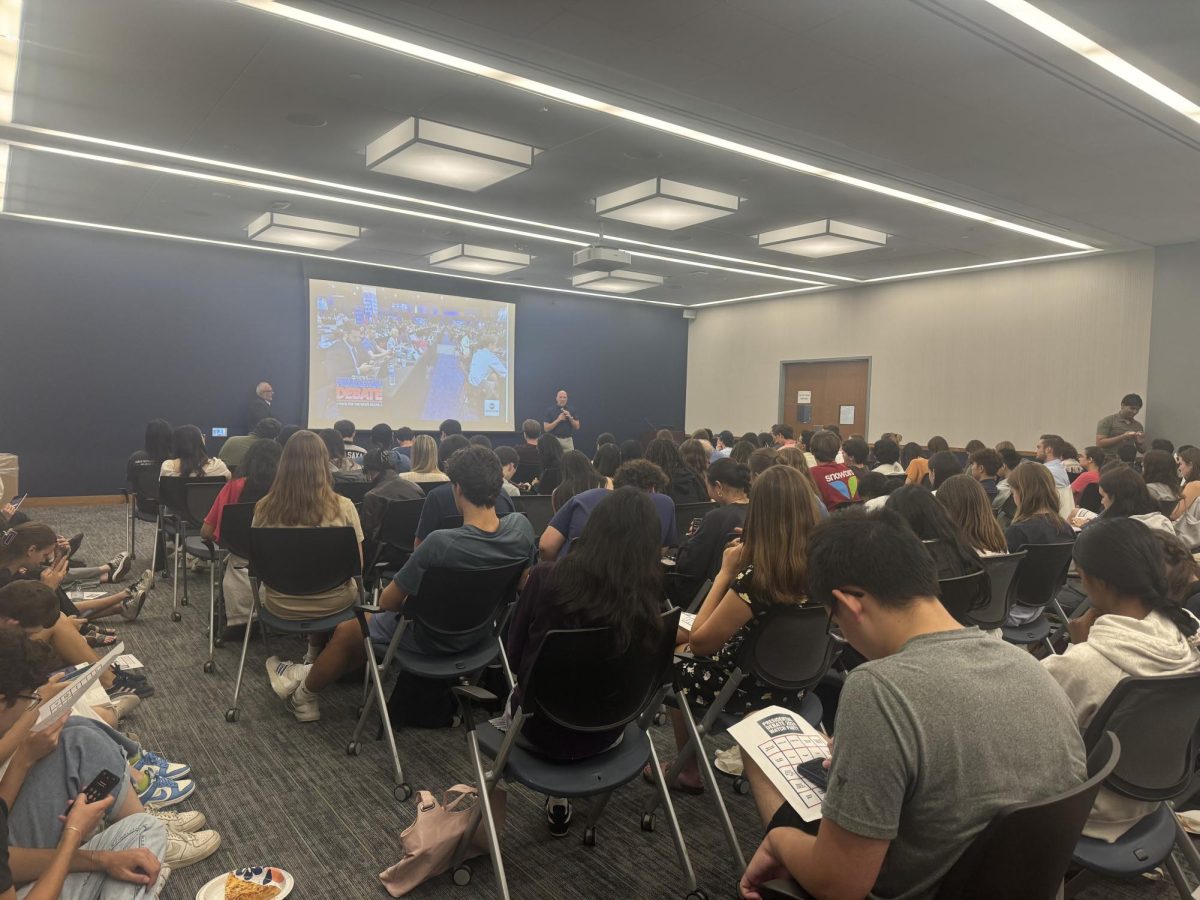 Nora Toscano/The Hoya | GU Politics hosted a watch party for the presidential debate between Donald Trump and Kamala Harris on Sep. 10.