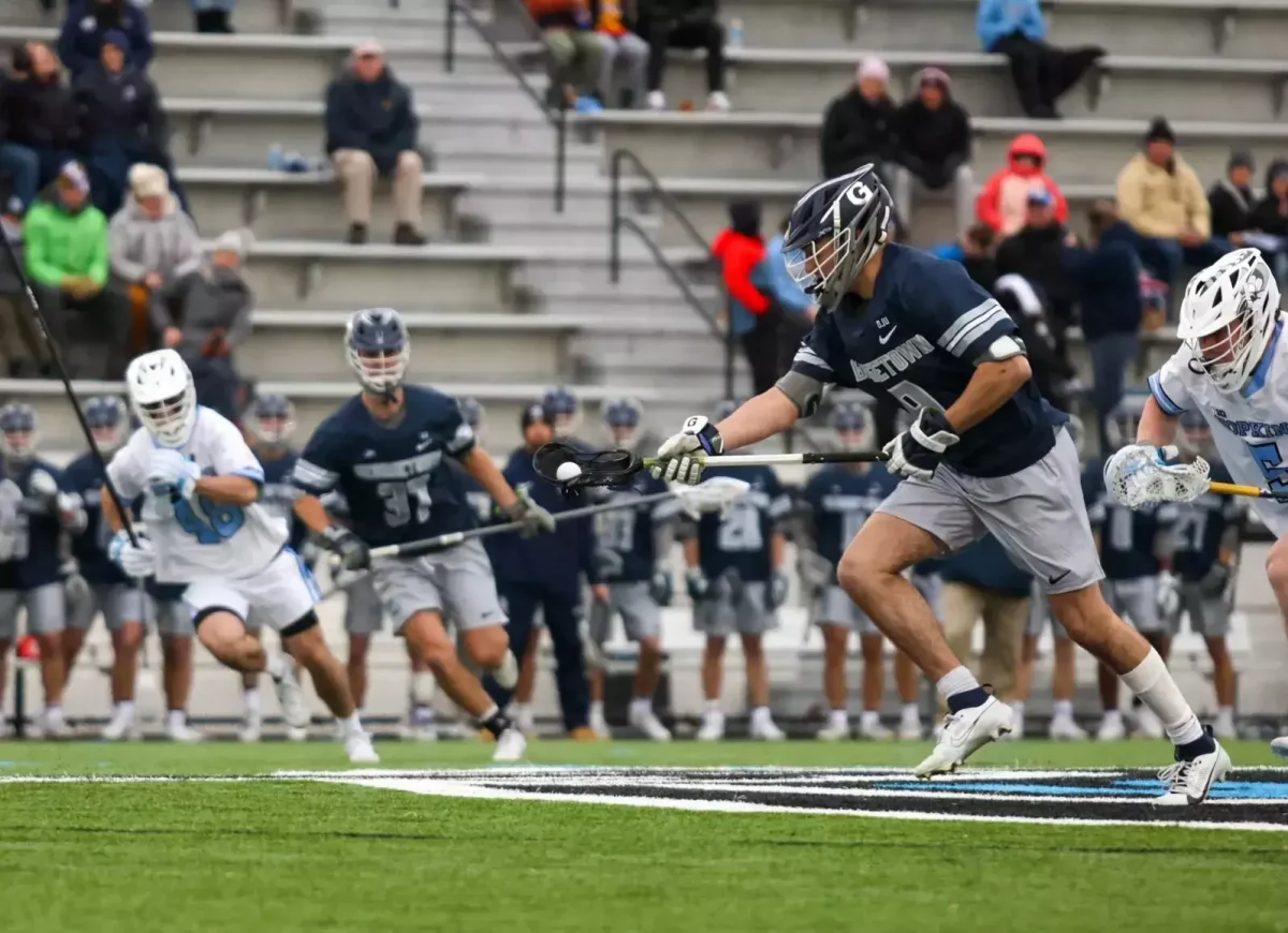 A Georgetown player runs with the ball in the Hoyas' matchup against Johns Hopkins Feb. 8. Georgetown dropped their matchup against the No. 8 Blue Jays 11-6. (GU Athletics)