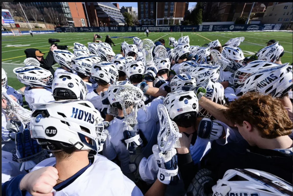 The No. 11 Georgetown University men's lacrosse team huddles ahead of their season opener Feb. 1. The Hoyas started off their season strong, getting revenge over a loss last season to the Loyola Maryland Greyhounds with a 13-6 win. (GU Hoyas)