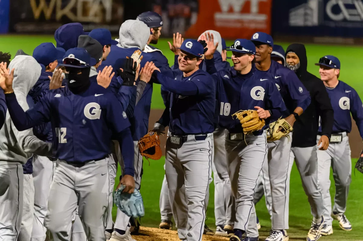 Georgetown celebrates after holding off George Mason for the last few innings in a close 15-14 contest Feb. 18. (GUHoyas)