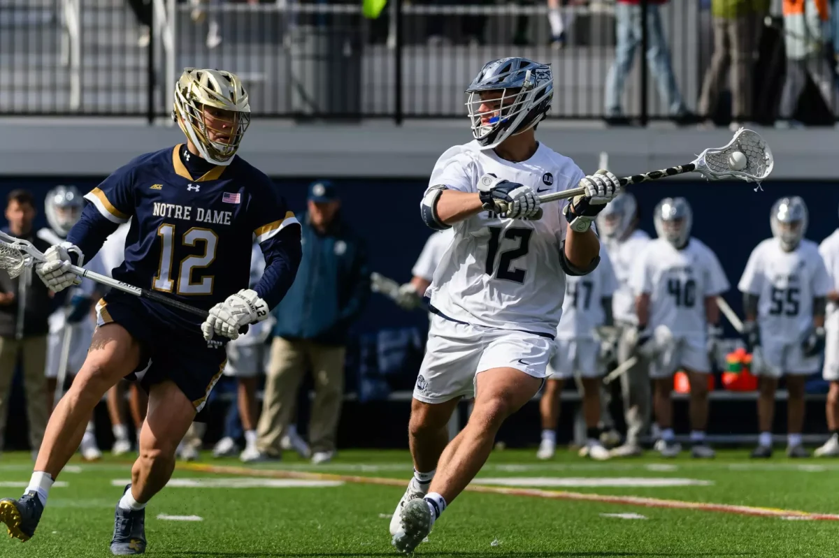 Graduate attacker Aidan Carroll (right) headlined Georgetown's award winners this season, putting up 53 points, the third most in the Big East.