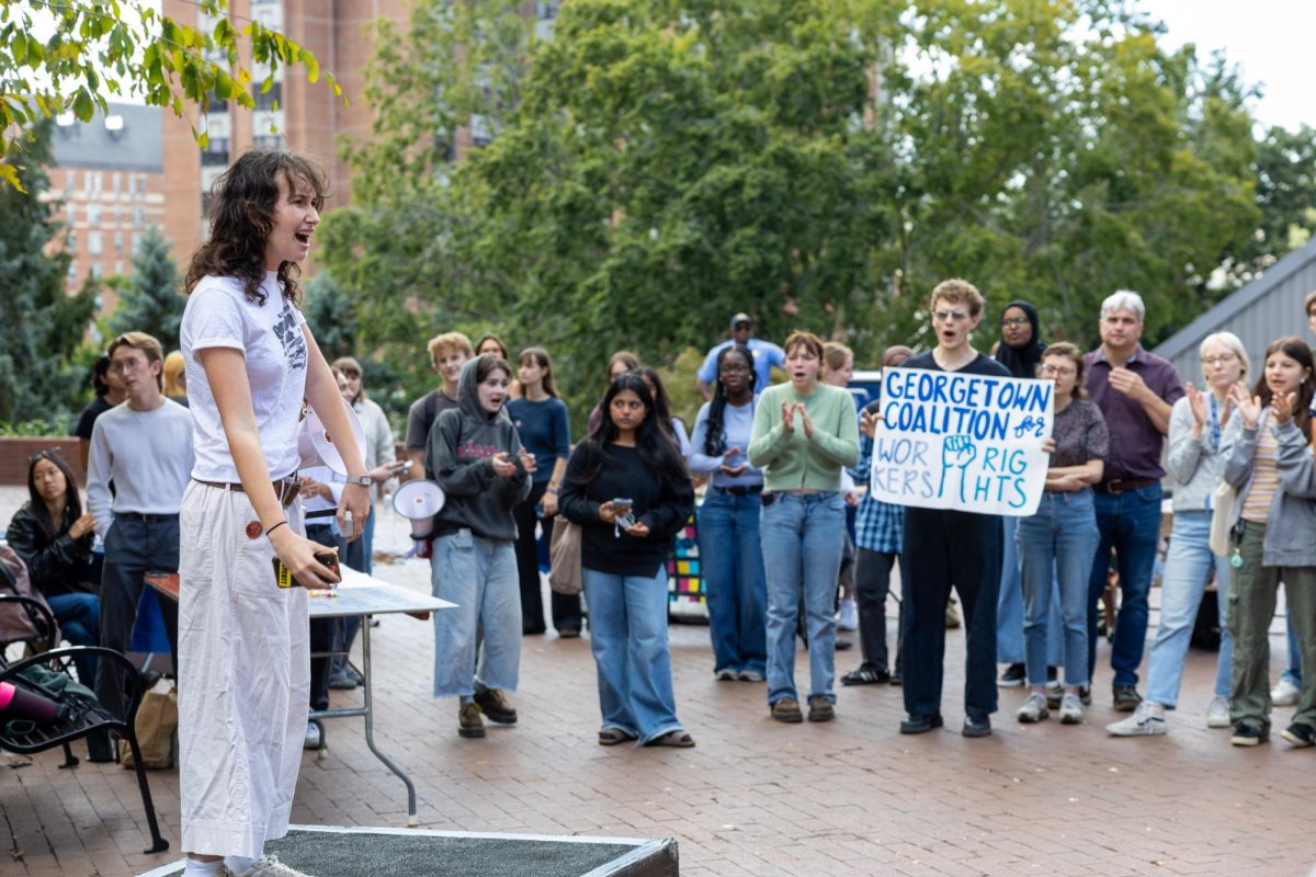 A week after Georgetown University rejected a student petition against its plans to transfer Georgetown University Transportation Shuttle (GUTS) drivers to a third party, around 80 students rallied in Red Square and the Leavey Esplanade in protest.
