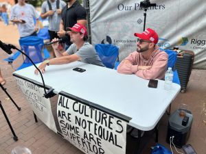 Four conservative influencers set up a “Let's Talk” table in Red Square Oct. 2, inviting students to debate right-wing ideology. 