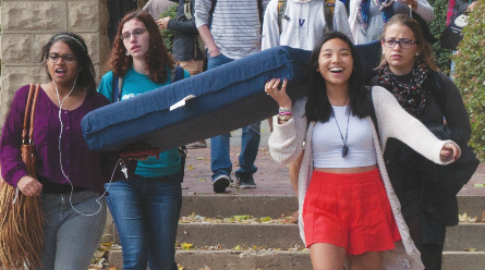 FILE PHOTO: MICHELLE XU/THE HOYA
Student activists, including author Zoe Dobkin (SFS 16), back left, carry a mattress during Octobers Carry the Weight event, a day of sexual assault awareness at college campuses across the country.