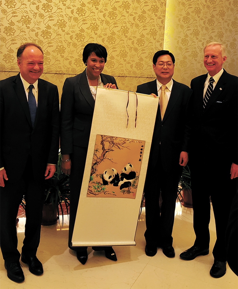 COURTESY KARIMA WOODS 
President John J. DeGioia, Mayor Muriel Bowser, Chinese People’s Association for the Friendship of Foreign Countries Vice President Xie Yuan and Ward 2 Councilmember Jack Evans pose for a photo during the trip.