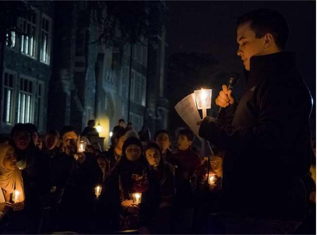 About 200 members of the community attended a vigil in Red Square on Wednesday night in solidarity with students and facutly affected by President Donald Trump’s immigration ban.