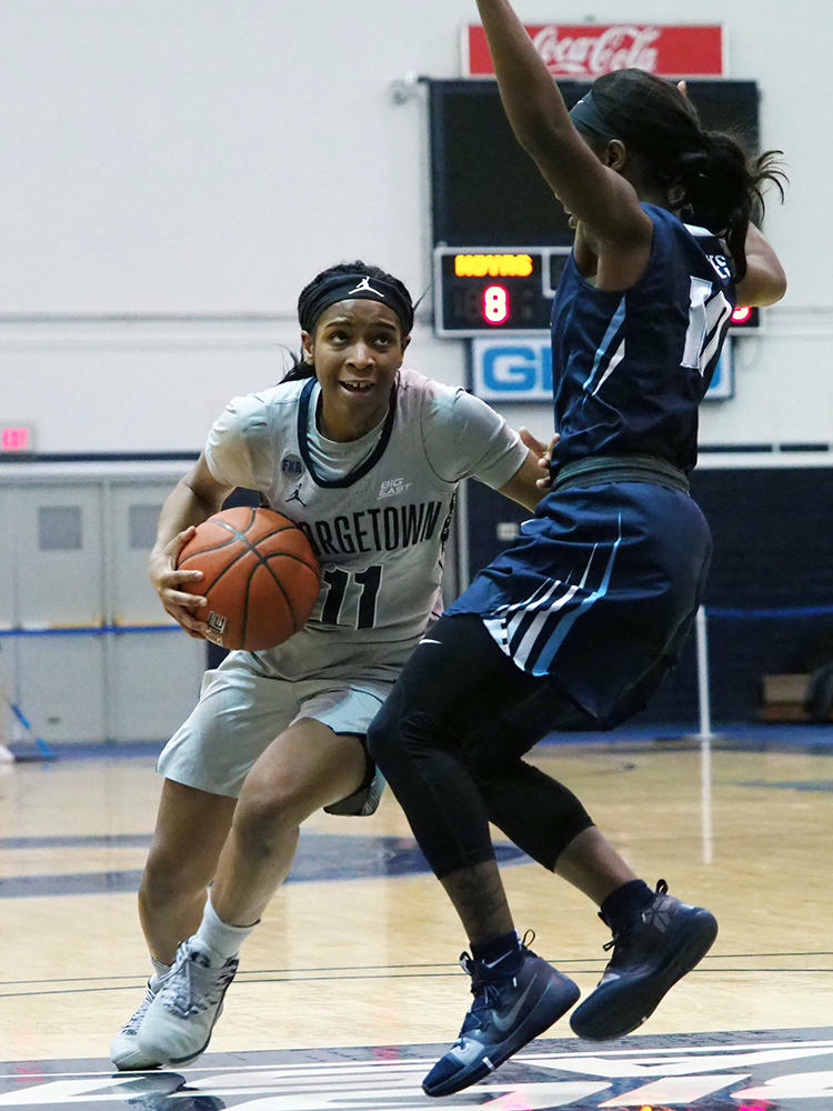 THE HOYA\Kirk Zieser | Senior guard Dionna White drives the ball down the court looking for a shot.