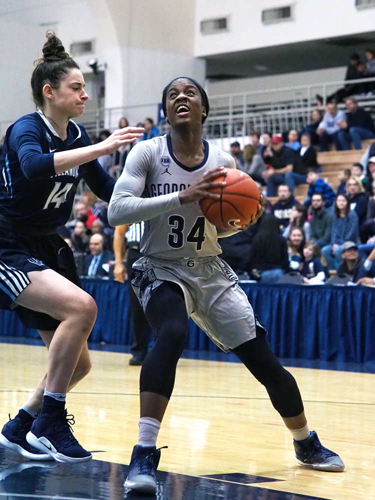 KIRK ZIESER/THE HOYA| Graduate guard Dorothy Adomako looks up for a shot in the paint against a Villanova defender. 