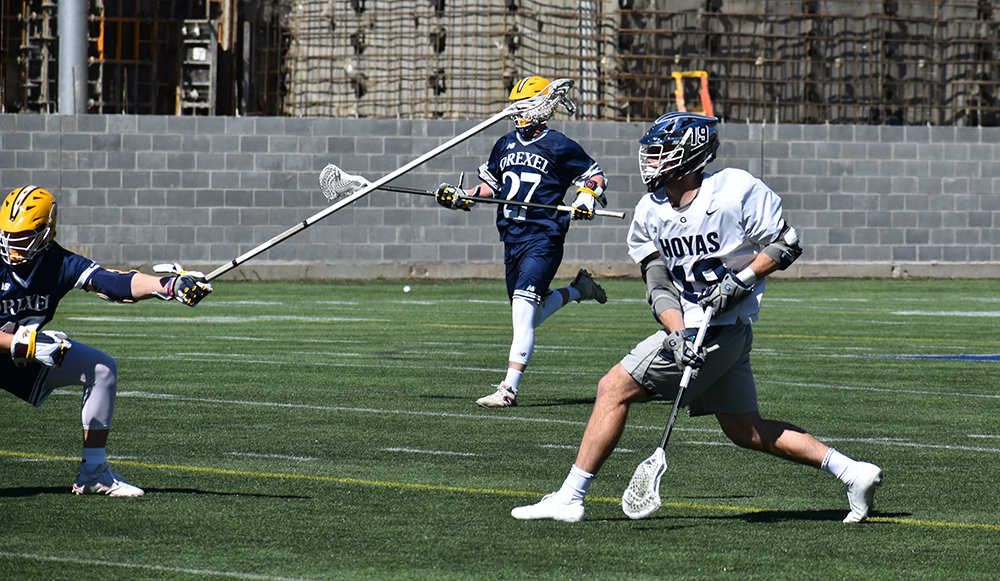 MARGARET FOUBERG/ THE HOYA | Junior attack Jake Carraway fires a shot against Drexel on March 16. Carraway tallied 4 goals in the win.