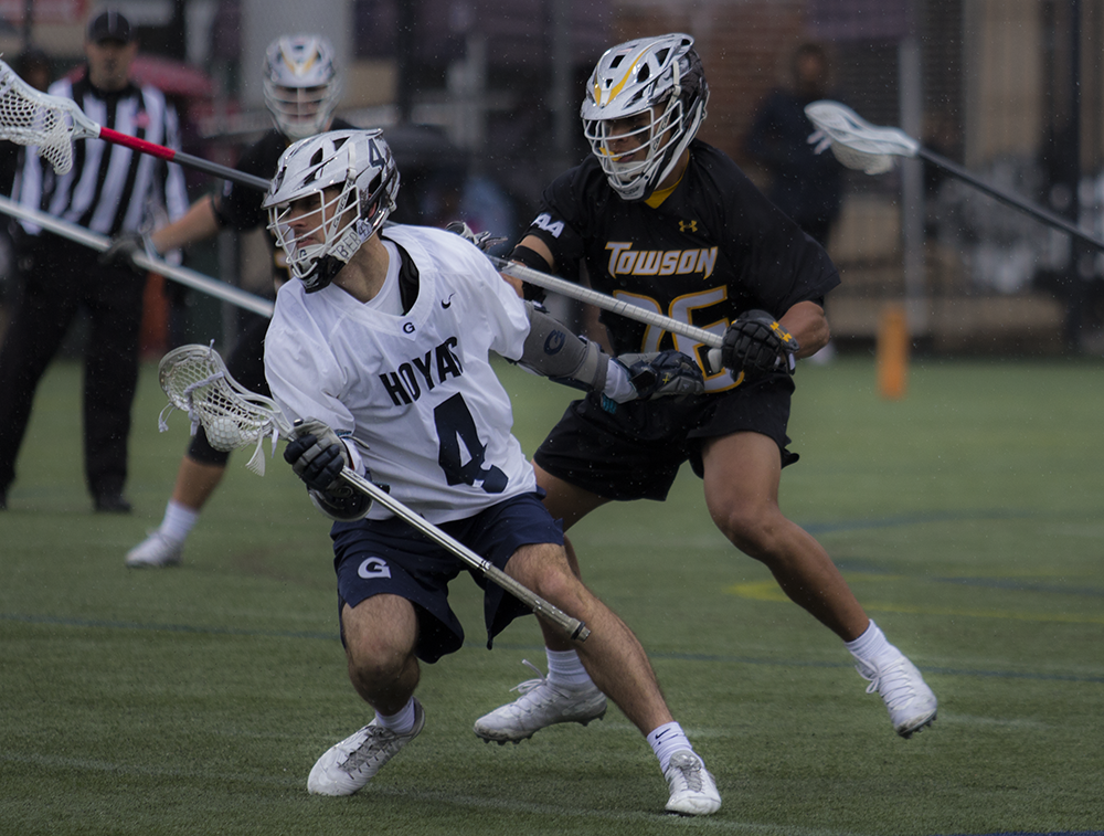 ELLIE STAAB/FOR THE HOYA | Senior attack Dan Bucaro pivots to get away from his defender. Bucaro scored a hat trick in the game against Marquette.
