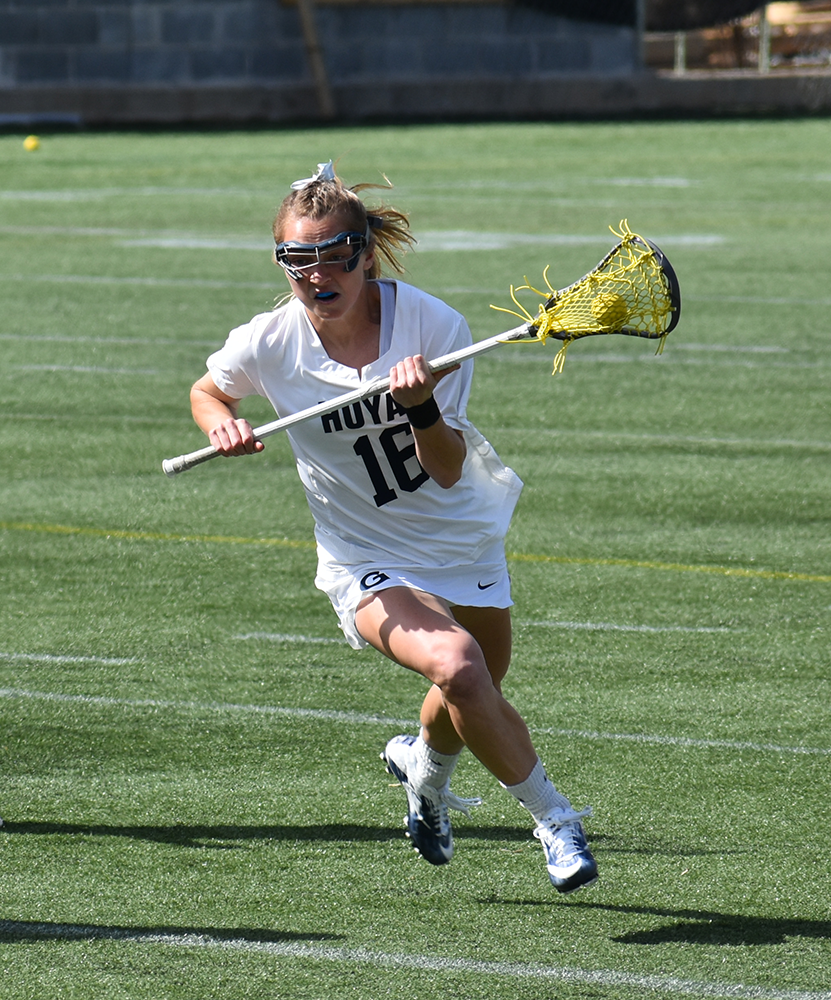 MARGARET FOUBERG/THE HOYA | Junior midfielder Natalia Lynch takes the ball down field during the matchup against Denver on Cooper Field. Lynch contributed one assist and two shots on goal in the loss.