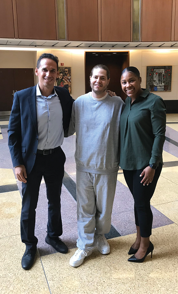 @MARCMHOWARD / TWITTER | Zack Johnson (center) is a student in the Georgetown Prison Scholars Program, founded by Professor Marc Howard (left).