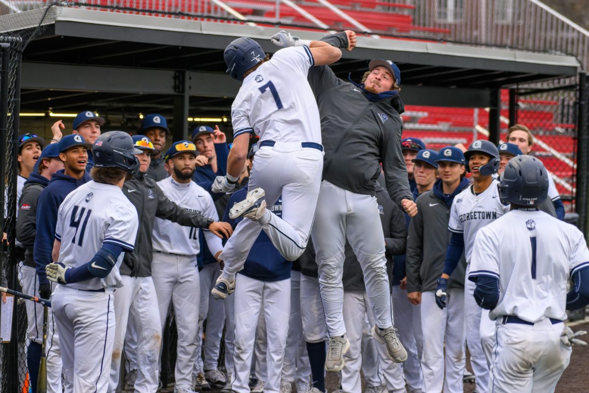 GUHoyas | First baseman Christian Ficca celebrates in the dugout.