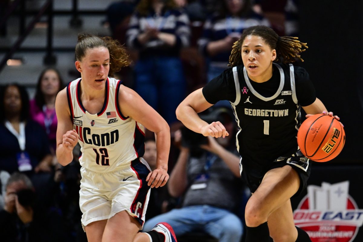 GUHoyas | Senior guard and all-tournament honoree Kelsey Ransom dribbles past UConn guard Ashlynn Shade in transition. Ransom averaged 11.5 points, 5 assists and 2 blocks in the tournament.