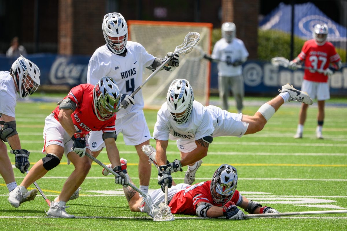 GUHoyas | Hoya and Red Storm players dive for a loose ball on Cooper Field. Georgetown dominated its opposition on the day.