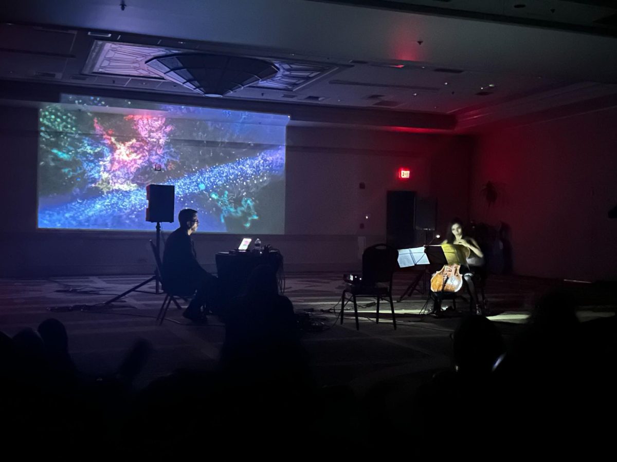 Camille Vandeveer/The Hoya | Composer Felipe Pérez Santiago and cellist Cristina Aristas performance at the Earth at the Crossroads 2.0 conference merged art and science, while inviting reflection on the urgent call to address the climate crisis.