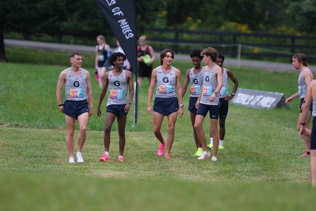 Georgetown men's cross country gets ready for the 6,000-meter race at the starting line.