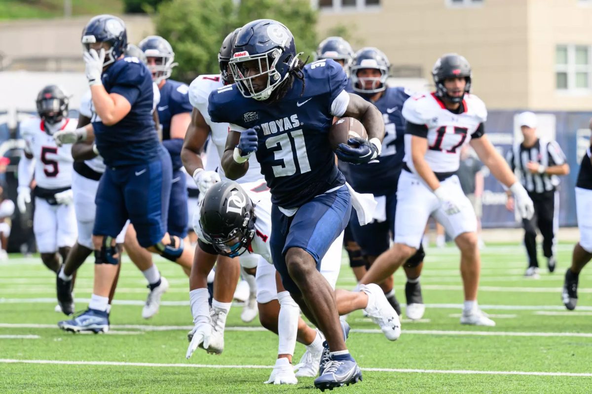 Georgetown Hoyas running back sophomore Bryce Cox rushes the football towards the end zone.