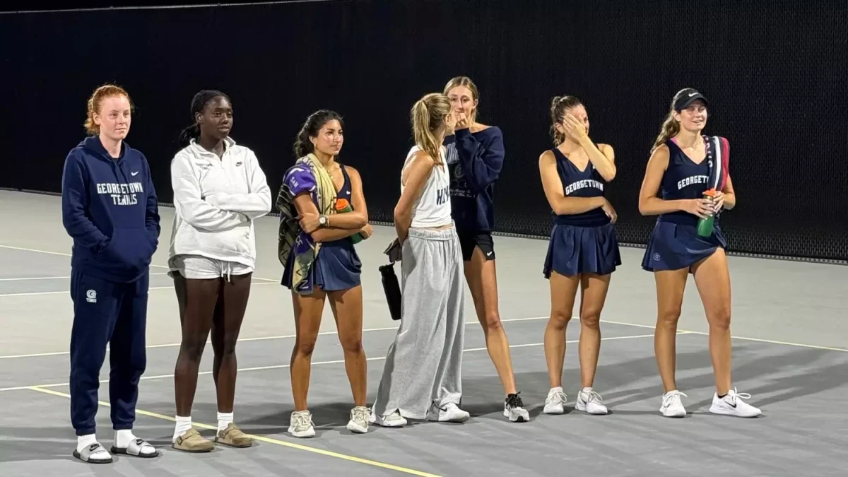 The Women's Tennis Team are presented with their awards after a successful showing in the Towson Dual Tournament