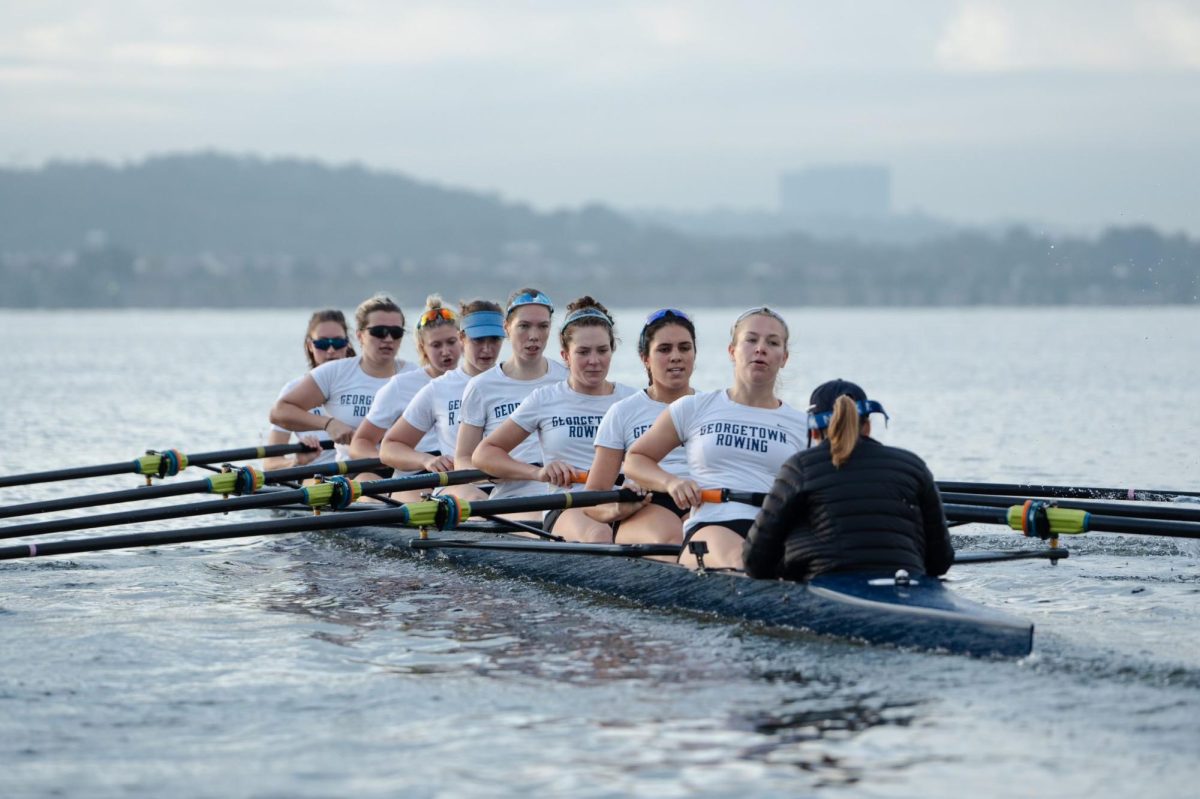 The Hoyas take a stroke together in an eight during morning practice on the Potomac River. (Courtesy of Hadley Winslow)