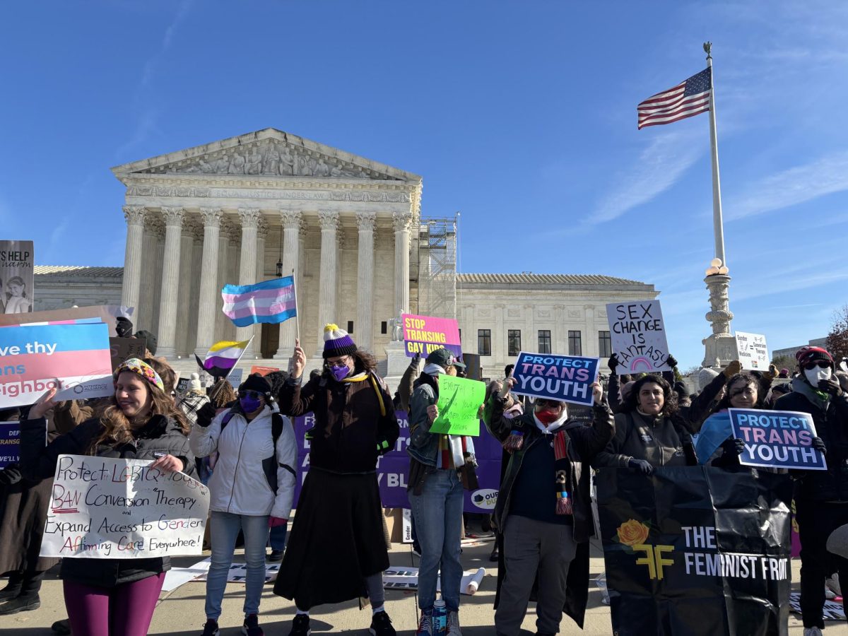 Protestors gathered on the steps of the Supreme Court as it heard arguments regarding a ban on gender-affirming healthcare for minors.