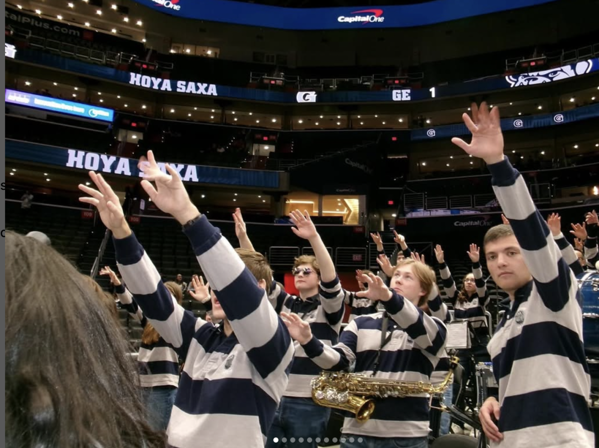 The Georgetown Pep Band cheers on the men's basketball team during a game at Capital One Arena this season. (@gupepband/Instagram)