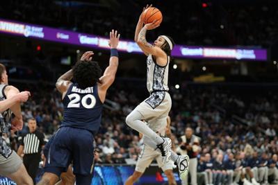 Malik Mack shoots the ball over an Xavier player. Mack scored a season-high 26 points in Georgetown's win over the Xavier Musketeers Jan. 3. (InsideNoVa)
