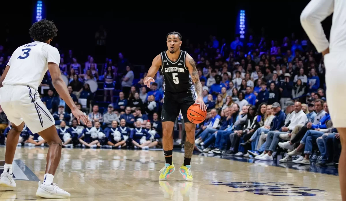 Graduate guard Micah Peavy dribbles the ball down the court during Georgetown's 74-69 loss at Xavier Feb. 4. Peavy finished the game with 27 points, a season high. (GU Hoyas) 