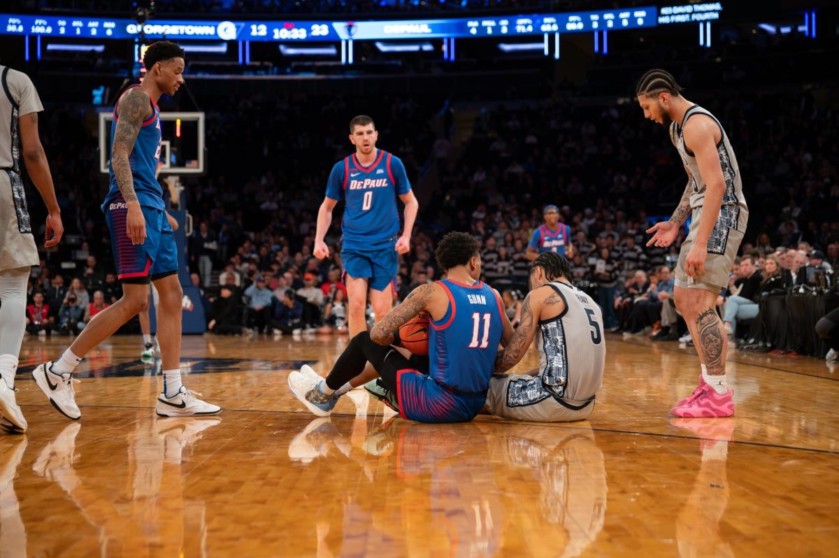 Georgetown graduate guard Micah Peavy and DePaul guard C.J. Gunn in the aftermath of a fight for the ball. The Hoyas fell to the Blue Demons, 71-67, in the first round of the Big East tournament March 12.