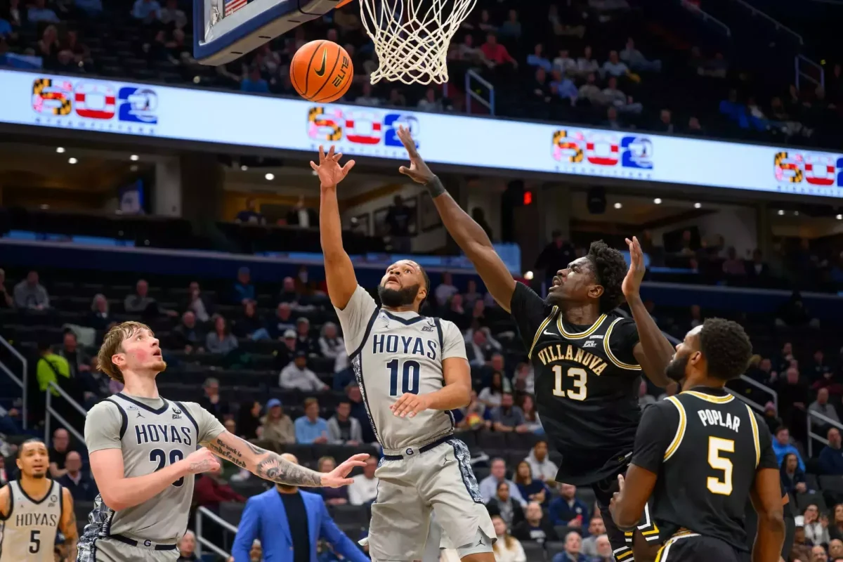 Junior guard Jayden Epps shoots a layup against Villanova University March 4 while sophomore forward Drew Fielder boxes out a Villanova defender. Both Epps and Fielder have entered the transfer portal this offseason. (Georgetown Athletics)