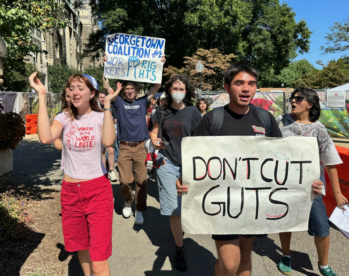 Georgetown University students delivered a petition with 1,130 signatures demanding the university reverse its decision to shift management of Georgetown University Transportation Shuttle (GUTS) to a third-party vendor.