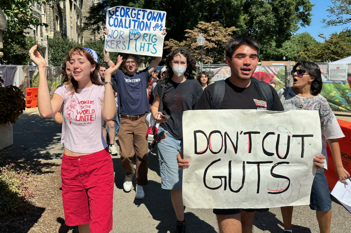Georgetown University students delivered a petition with 1,130 signatures demanding the university reverse its decision to shift management of Georgetown University Transportation Shuttle (GUTS) to a third-party vendor.