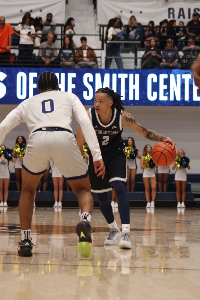 Malik Mack (above) starred in his return to action, notching 20 points and four assists as the Hoyas took down the George Washington Revolutionaries in a preseason scrimmage.