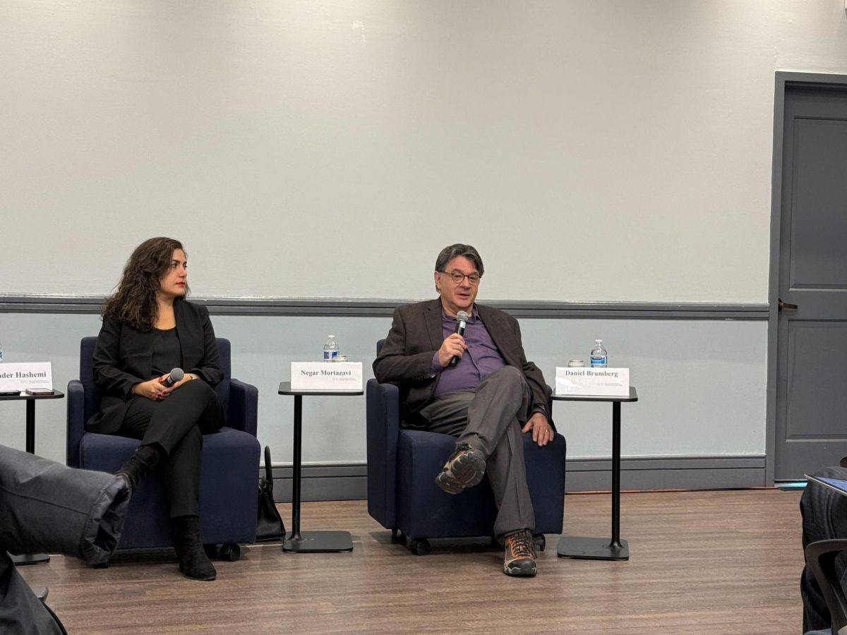 Negar Mortzavi, a senior fellow at the Center for International Policy and Daniel Brumberg, a Georgetown University associate professor discuss Iranian protests at a Georgetown University event Jan. 22. (The Hoya/Andrew Jiang)